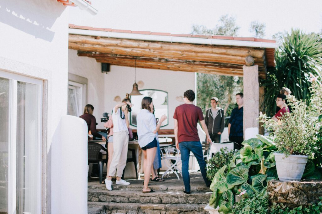 People Standing Under the Awning